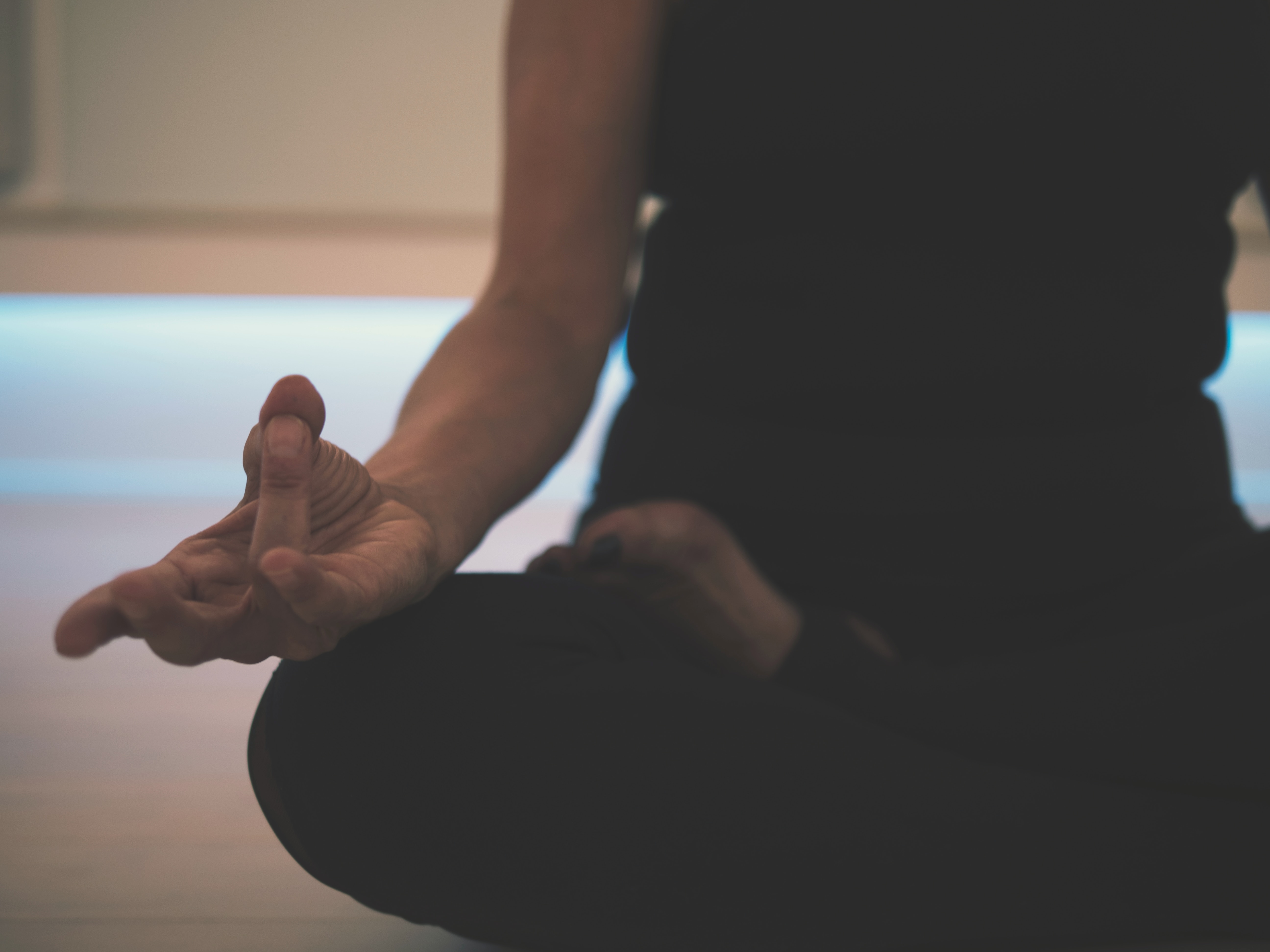 A woman in a black vest and energy is sat in the lotus position and holding her hand in the gyan mudra post.

Pandora's Health blog.

Image courtesy of Unsplash.